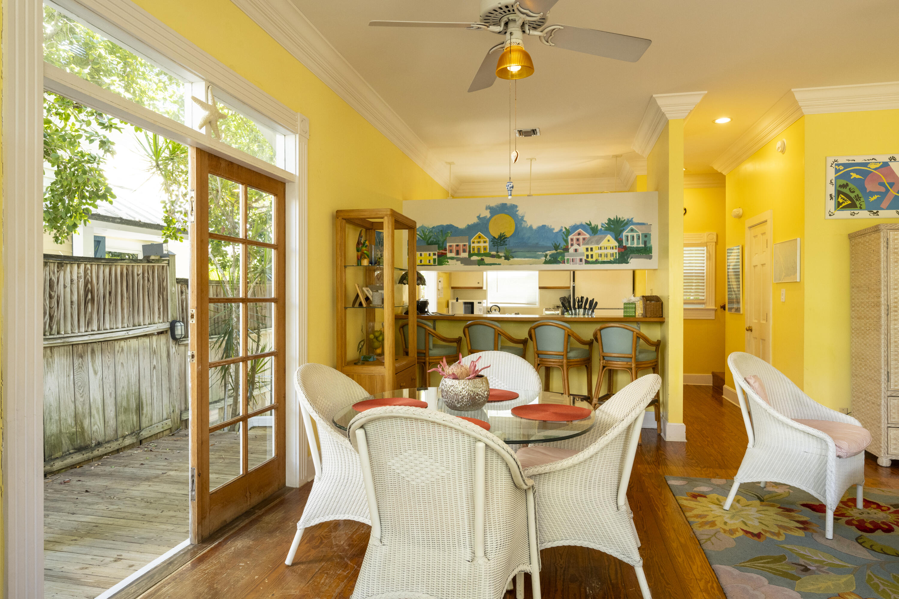 1003 United Street, Unit B Key West, FL 33040 - Photo 8 of 39 a dining room with furniture and a floor to ceiling window