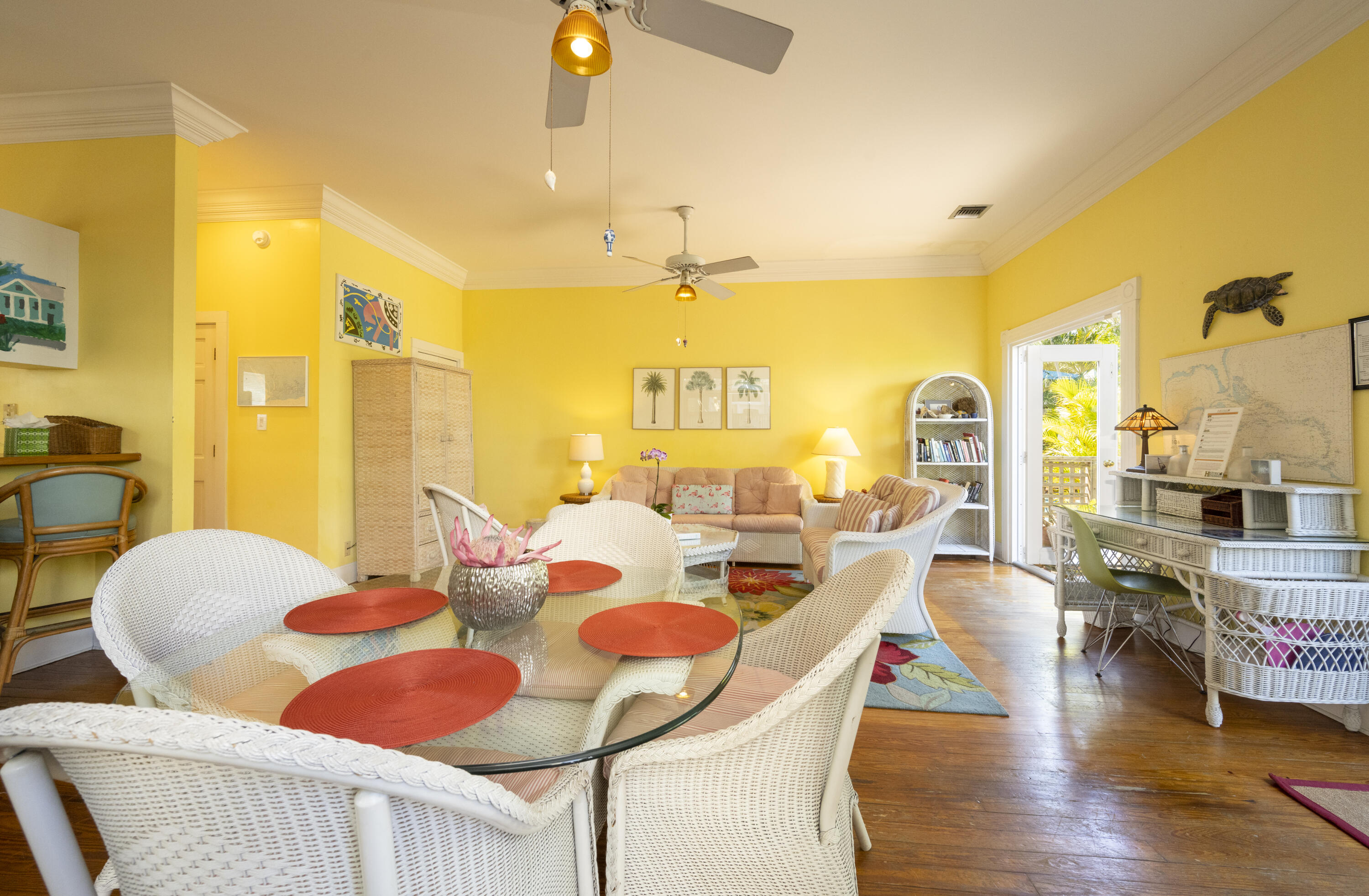 1003 United Street, Unit B Key West, FL 33040 - Photo 10 of 39 a view of a dining room with furniture and wooden floor