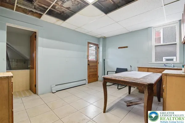 a view of an empty room with glass door