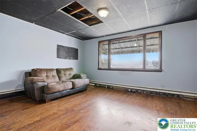 a view of kitchen with refrigerator and window