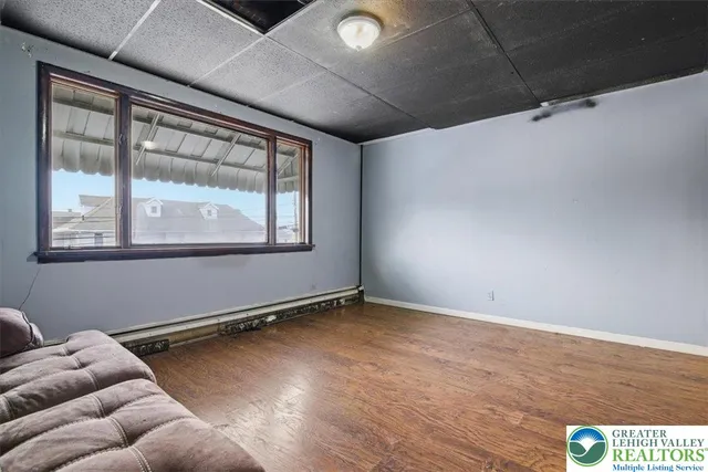 a kitchen with stainless steel appliances granite countertop a refrigerator and a stove