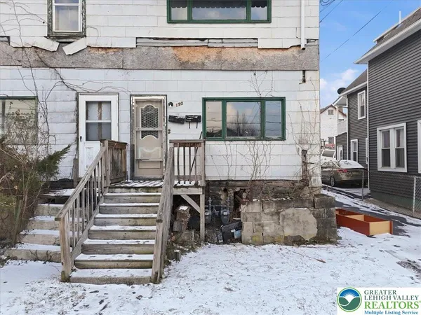 a view of a hallway with stairs