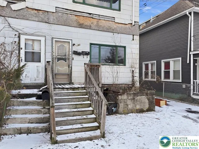 a view of a hallway with stairs