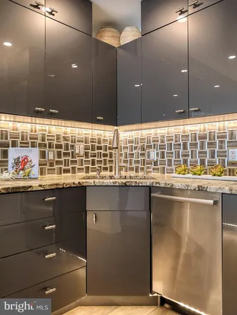 a kitchen with a sink and cabinets