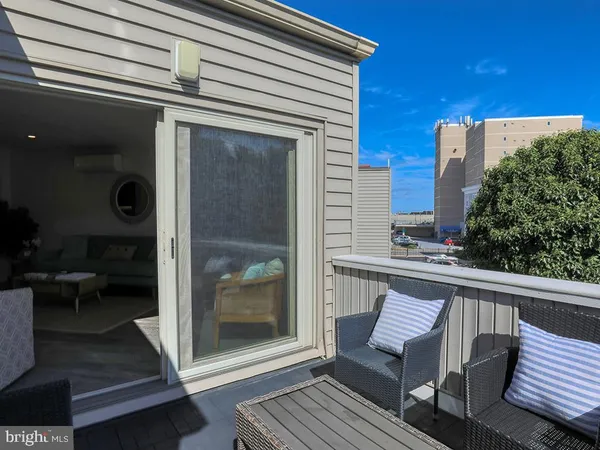a view of a balcony with chair and table