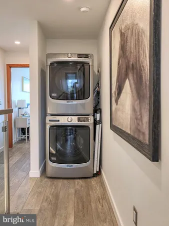 a utility room with wooden floor and a fireplace