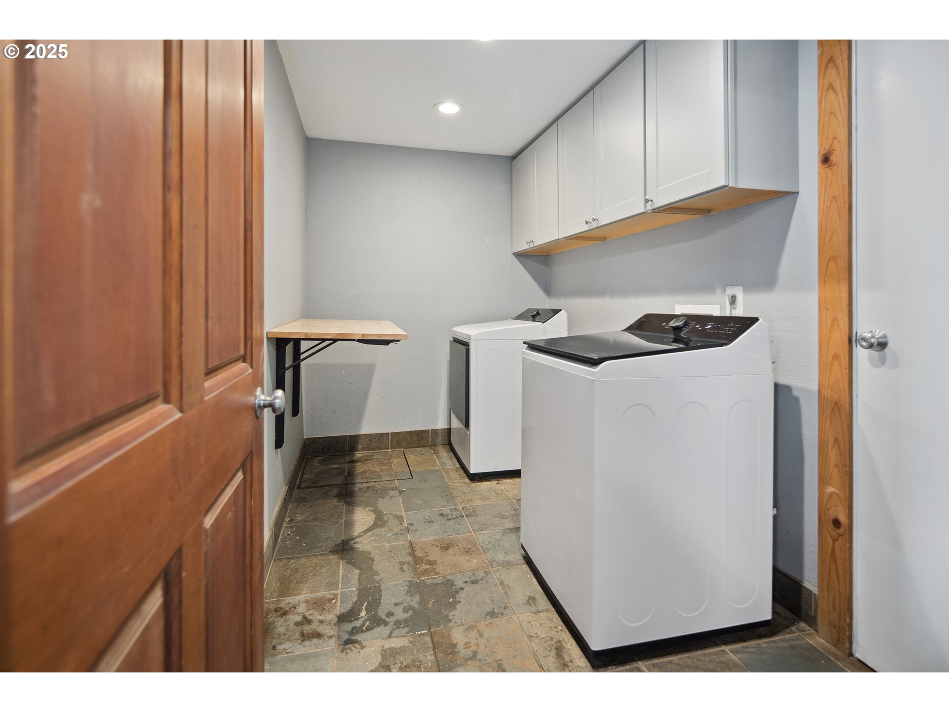 34680 Northeast Kramien Road Newberg, OR 97132 - Photo 17 of 40 a kitchen with a refrigerator and white cabinets