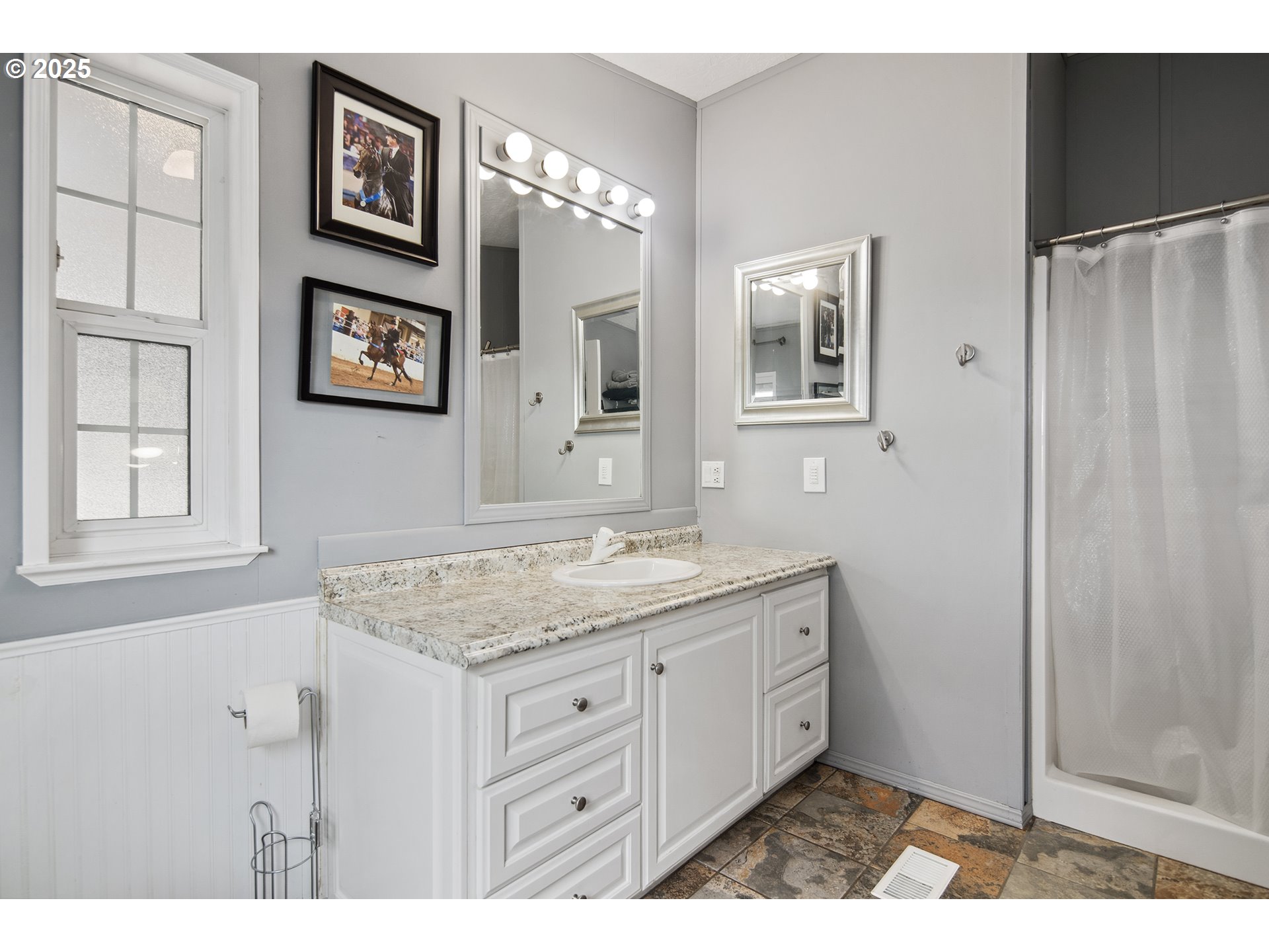 34680 Northeast Kramien Road Newberg, OR 97132 - Photo 32 of 40 a bathroom with a granite countertop sink a mirror a vanity and shower