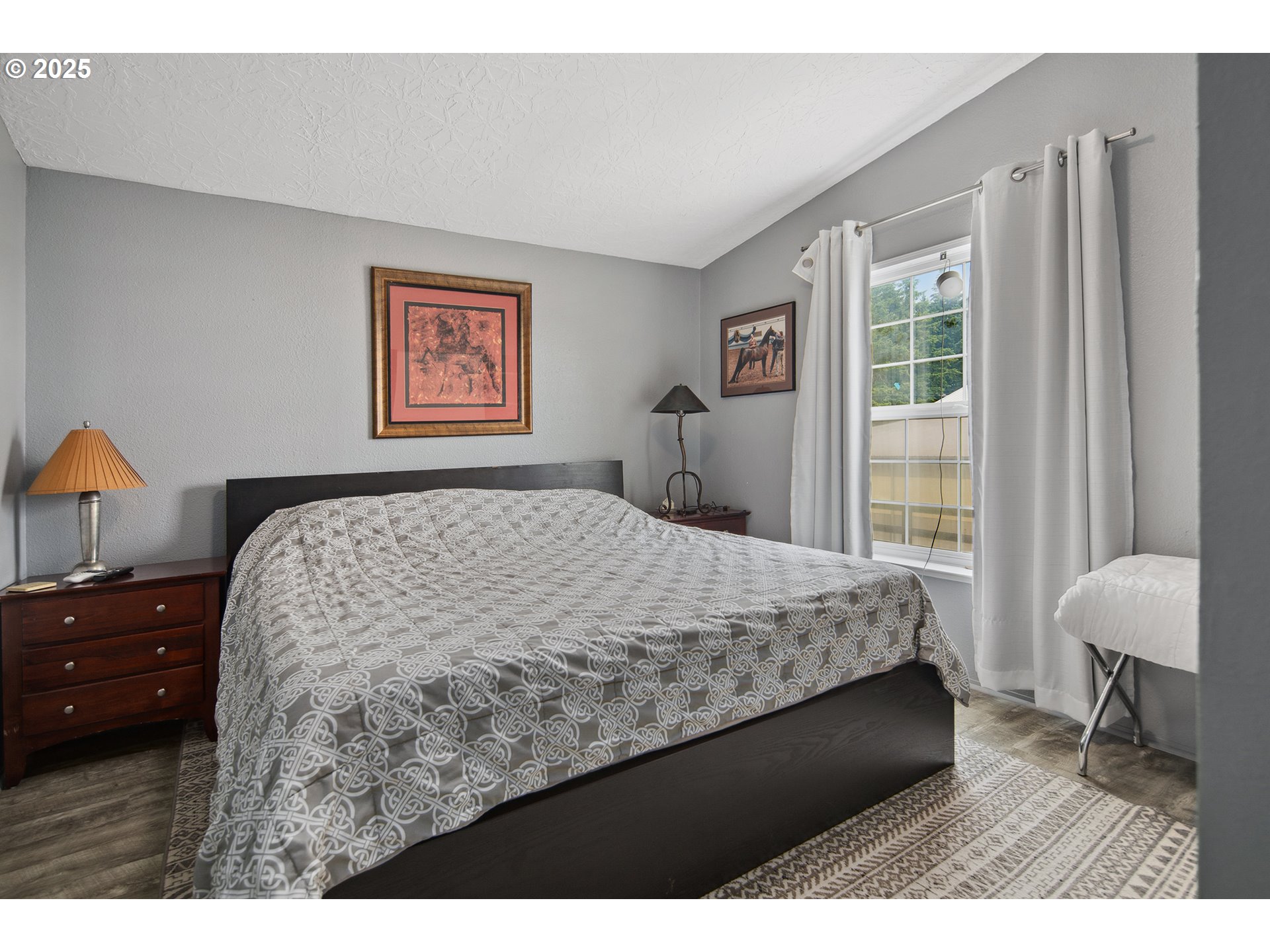 34680 Northeast Kramien Road Newberg, OR 97132 - Photo 33 of 40 a bedroom with a bed and a lamp on dresser