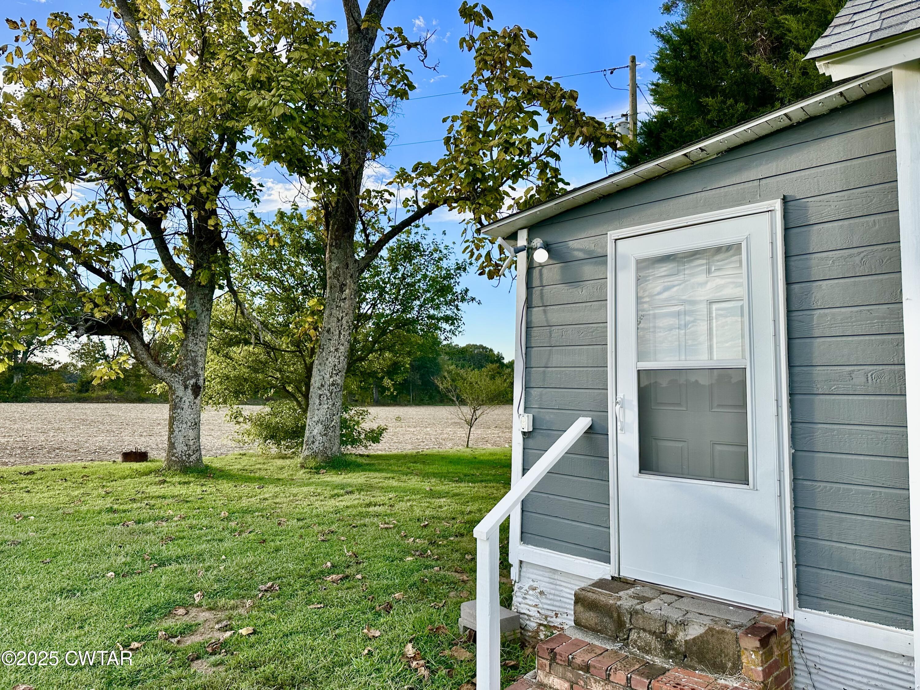 8867 State Highway 188 Friendship, TN 38034 - Photo 12 of 14 a view of backyard with cabin