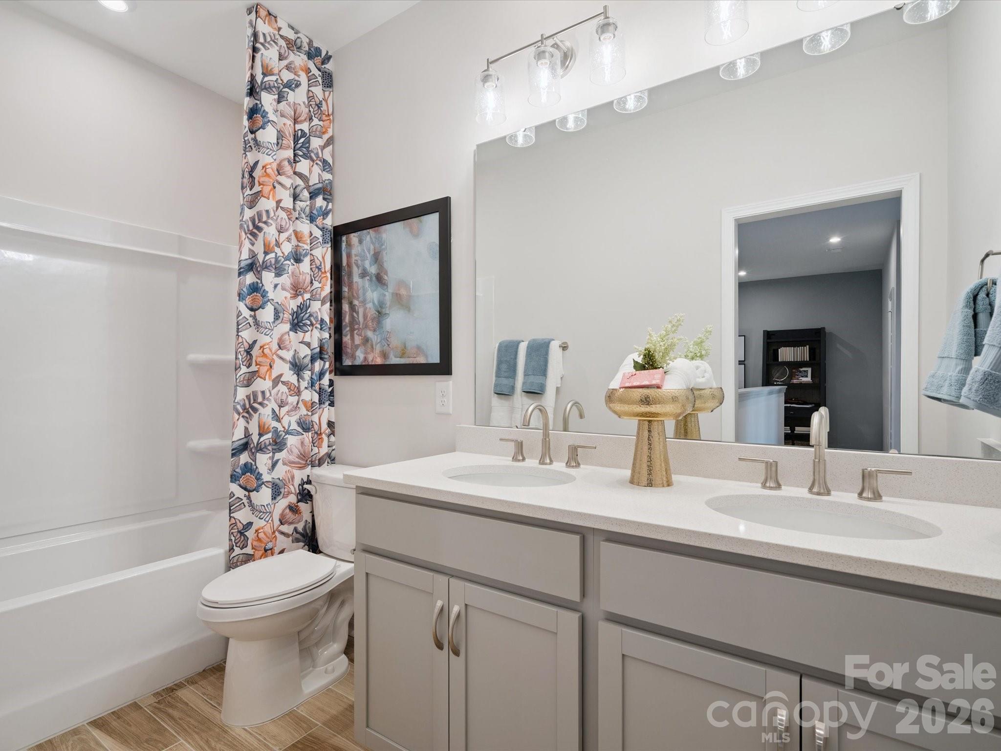 620 Webster Lane Cramerton, NC 28032 - Photo 11 of 19 a bathroom with a sink vanity mirror and toilet