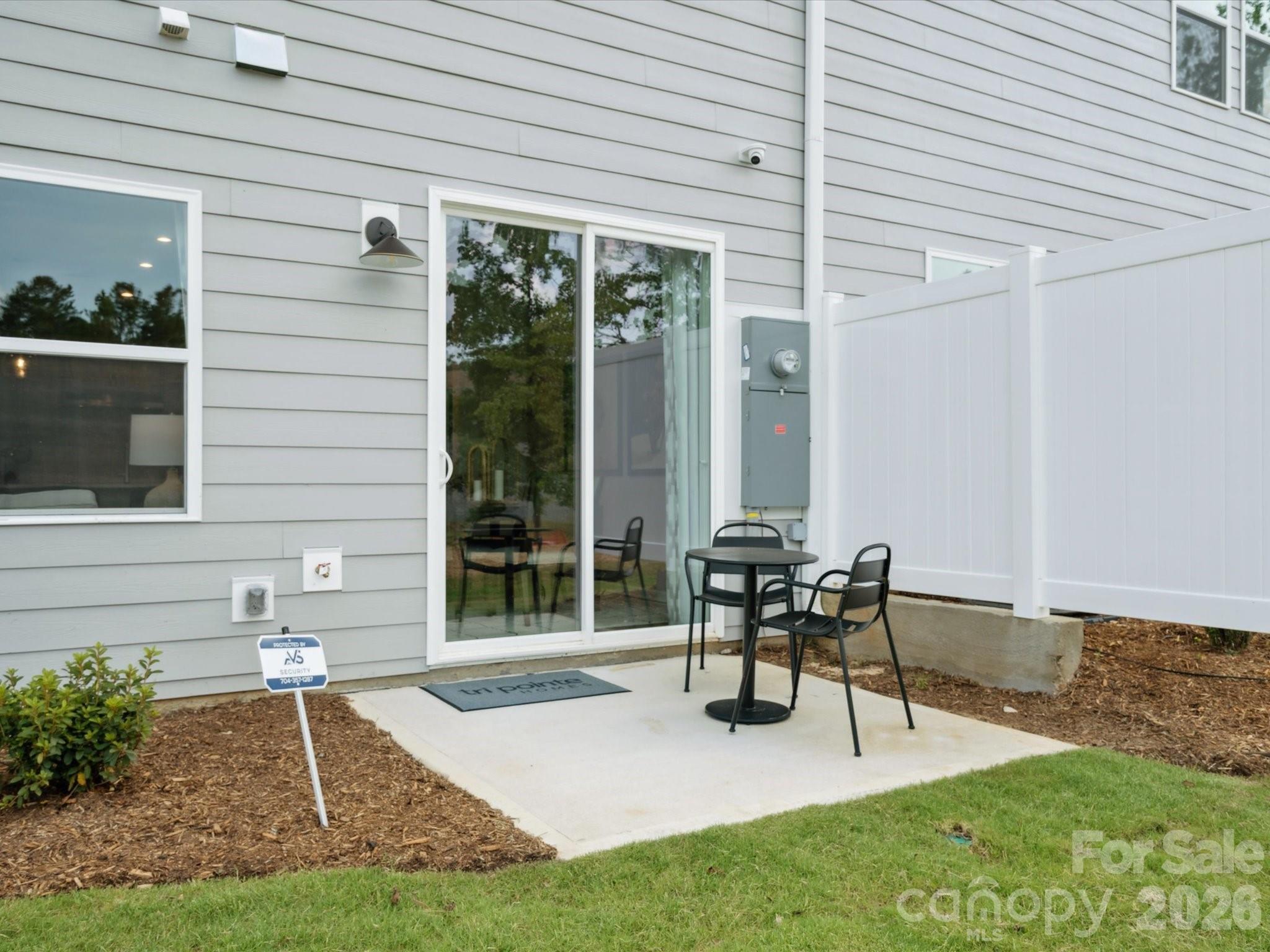620 Webster Lane Cramerton, NC 28032 - Photo 19 of 19 a patio with a table and chairs and potted plants