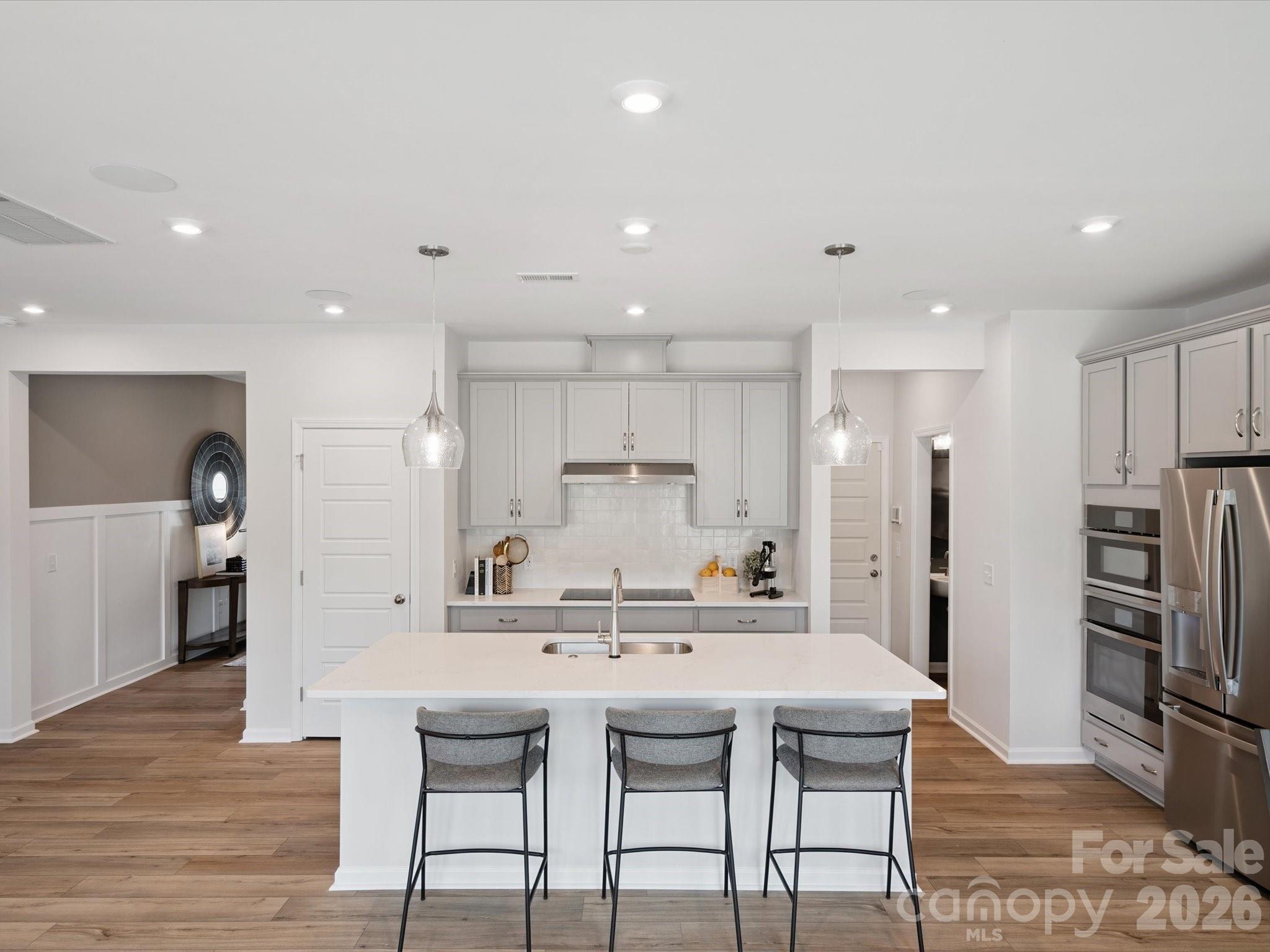 620 Webster Lane Cramerton, NC 28032 - Photo 6 of 19 a kitchen with kitchen island cabinets and refrigerator