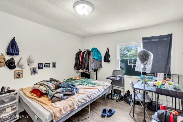 a bedroom with furniture and a bed