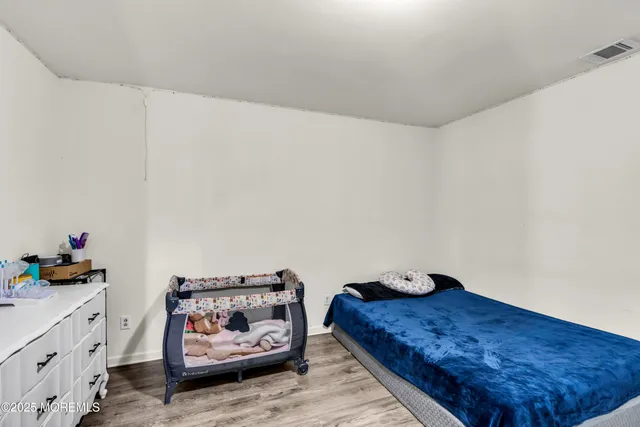 a bedroom with a bed and cabinets