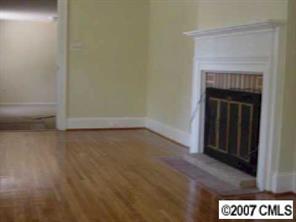 338 Marsh Road Charlotte, NC 28209 - Photo 6 of 7 a view of an empty room with a fireplace