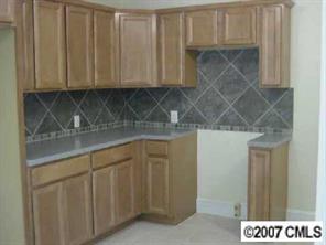 338 Marsh Road Charlotte, NC 28209 - Photo 7 of 7 a kitchen with stainless steel appliances granite countertop a sink and cabinets