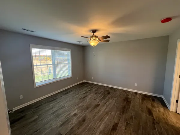 a bathroom with a double vanity sink toilet and shower