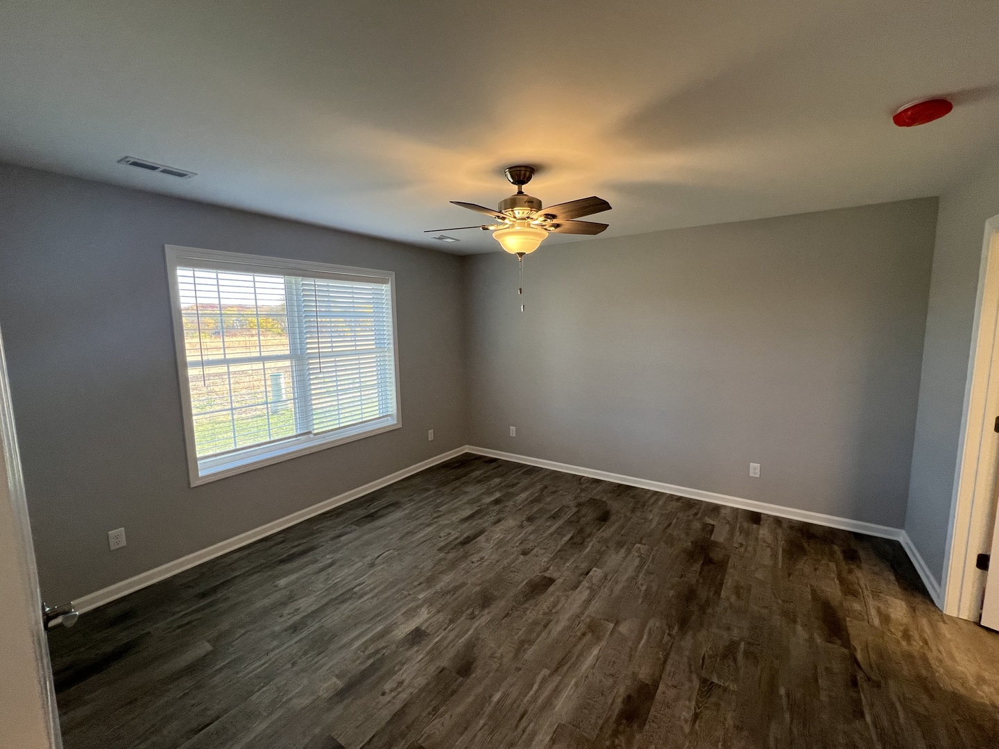 1107 South 2nd Street Oregon, IL 61061 - Photo 5 of 10 wooden floor in an empty room with a window