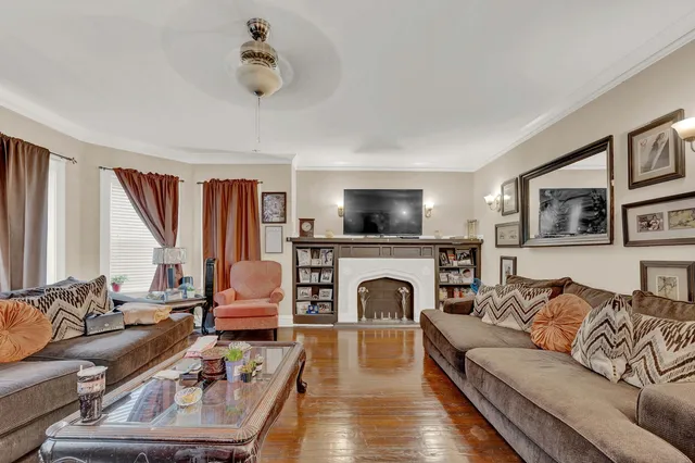 a living room with furniture and a fireplace