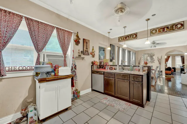 a kitchen with stainless steel appliances granite countertop a sink and cabinets