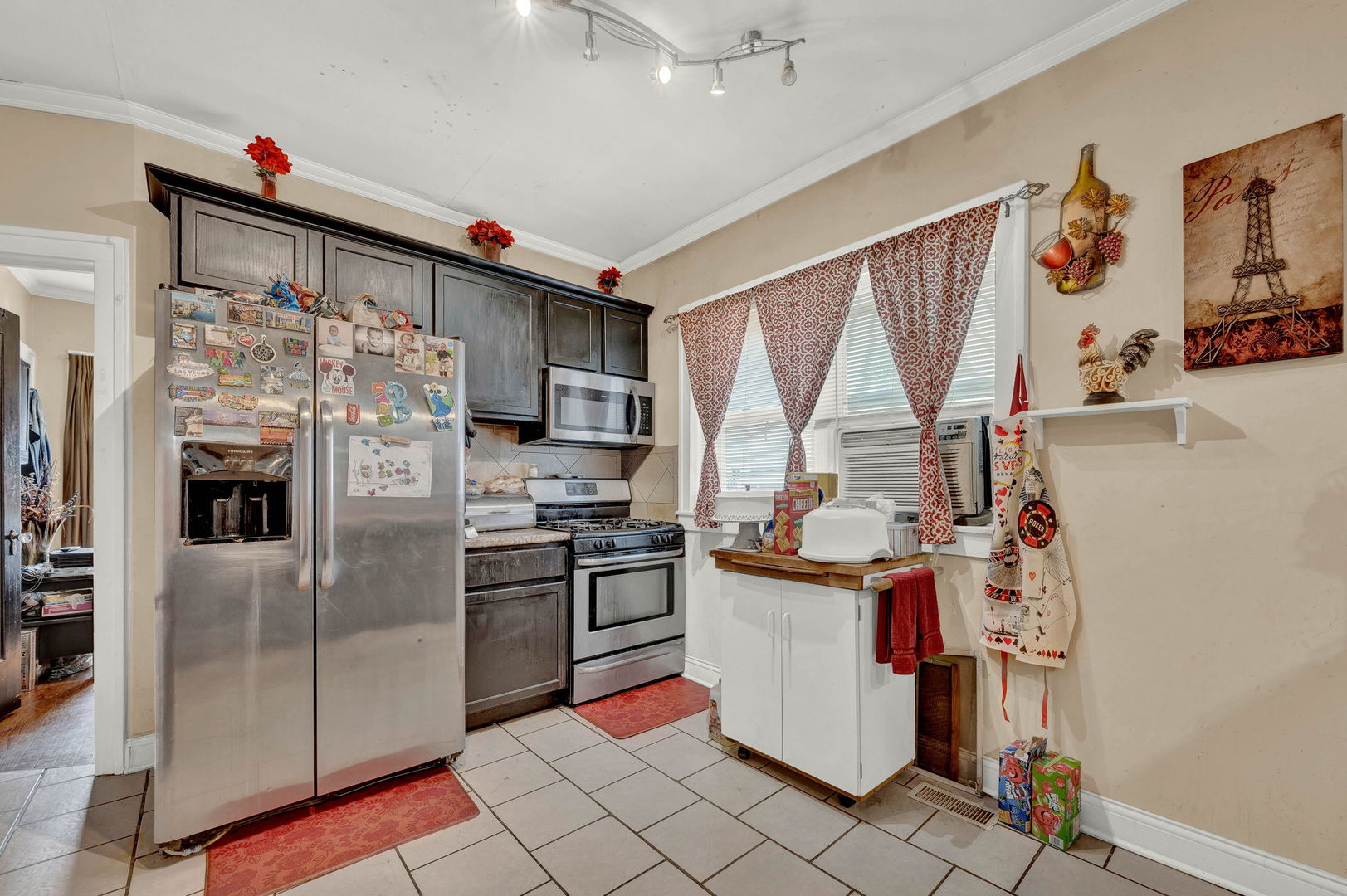 7800 South Aberdeen Street Chicago, IL 60620 - Photo 6 of 13 a kitchen with stainless steel appliances granite countertop a refrigerator and a stove