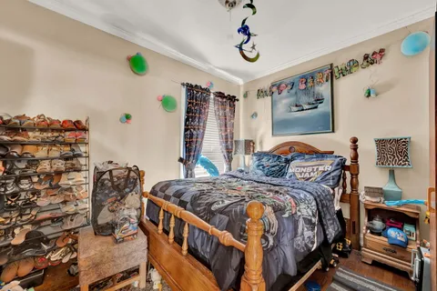 a bedroom with bed and a window