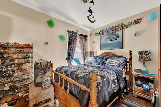 a bedroom with bed and a window