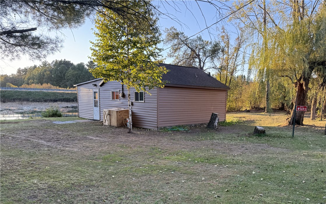 W5693 Trego Park Road Trego, WI 54888 - Photo 2 of 25 SOUTH SIDE FROM ROAD