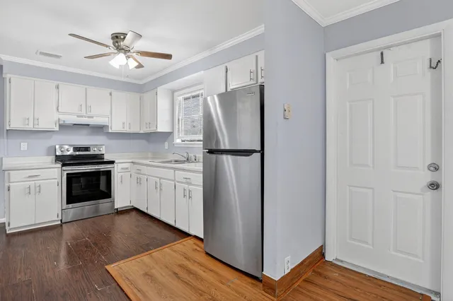 a kitchen with a refrigerator a sink and dishwasher