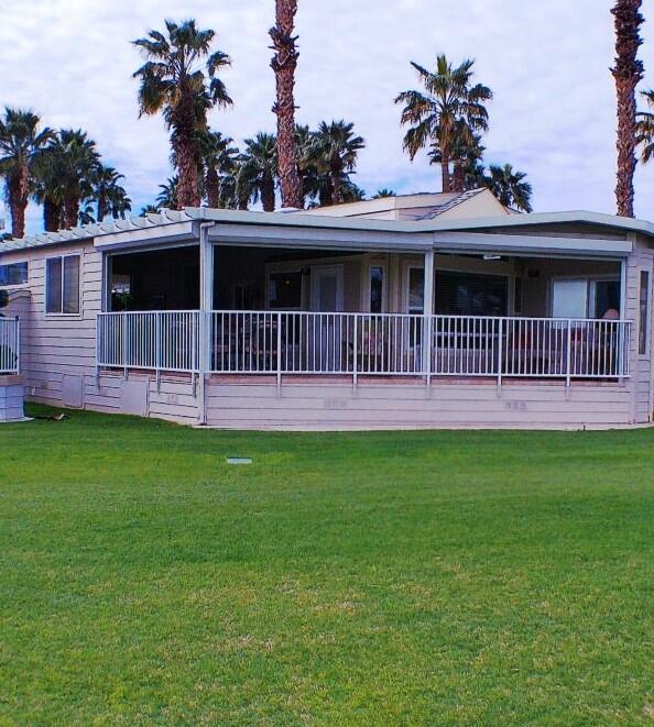 754 Ave 44, Unit 754 Indio, CA 92203 - Photo 43 of 50 a front view of a house with a garden