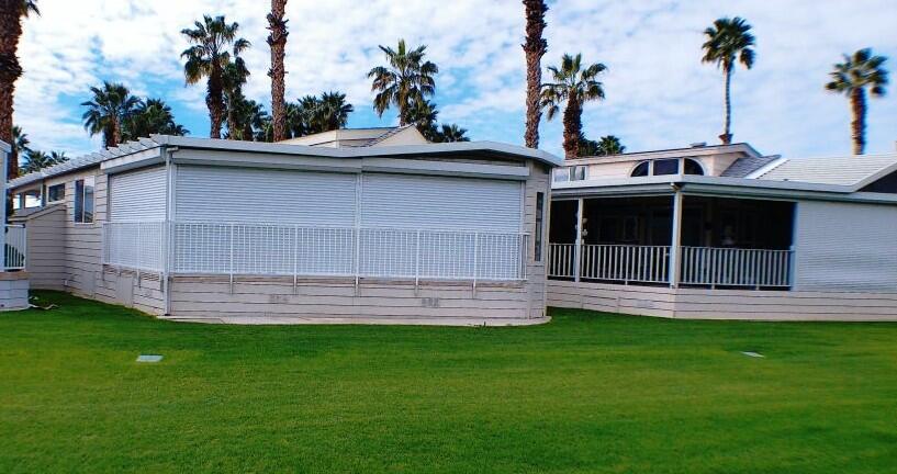754 Ave 44, Unit 754 Indio, CA 92203 - Photo 49 of 50 a front view of a house with a garden and plants