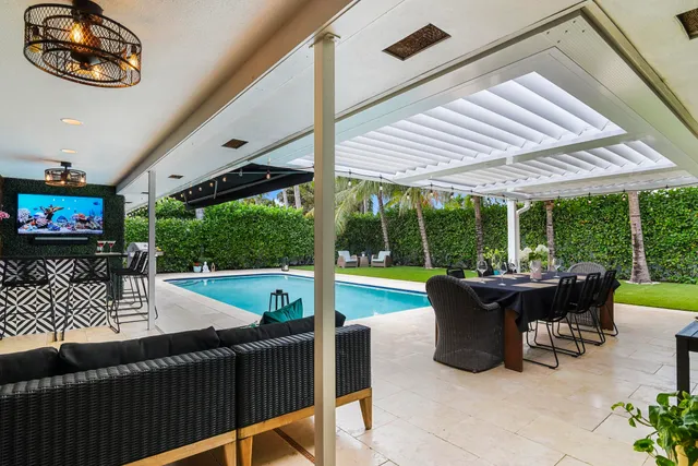 a view of a patio with a dining table and chairs