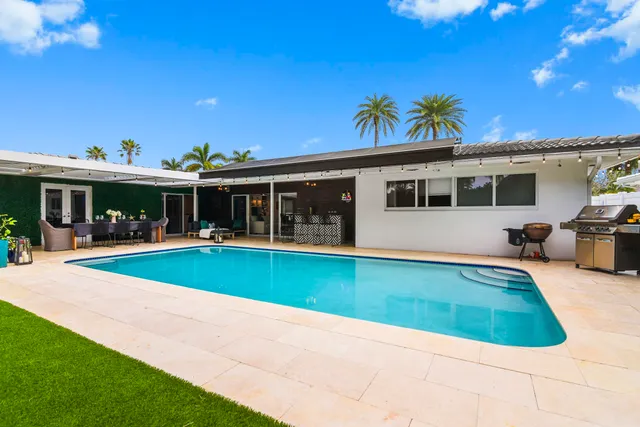 a view of pool with outdoor seating