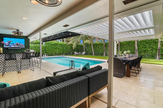 a view of a patio with a table and chairs