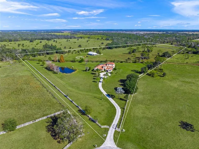 an aerial view of a golf course with a ocean view