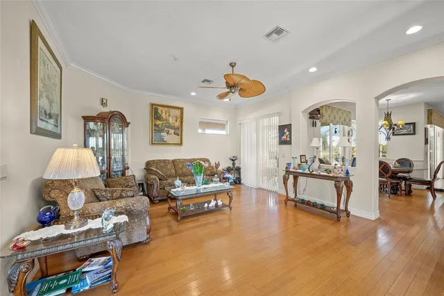 a kitchen with stainless steel appliances granite countertop a refrigerator a stove and a sink with granite countertops