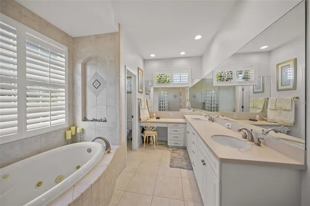 a living room with furniture and a ceiling fan