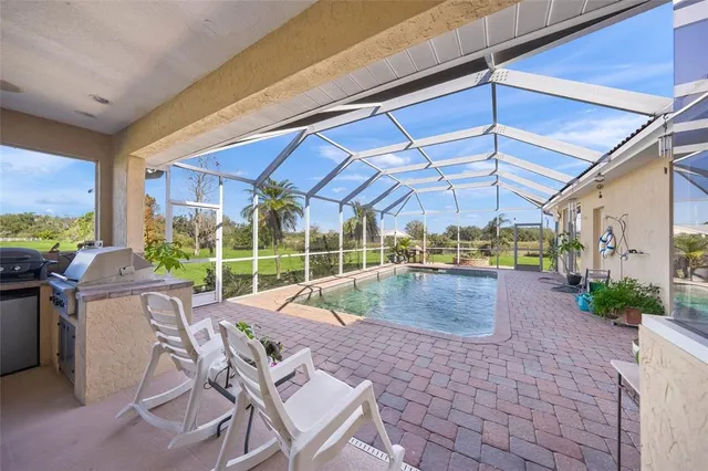 a view of a swimming pool with a patio