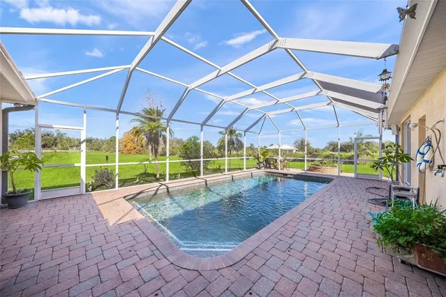 a view of a swimming pool with a patio