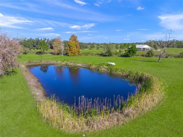 a view of a lake with a yard
