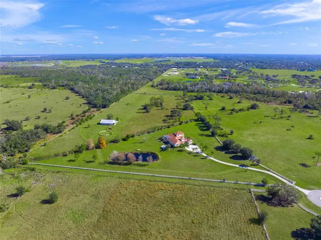 a view of a lake with houses in the back
