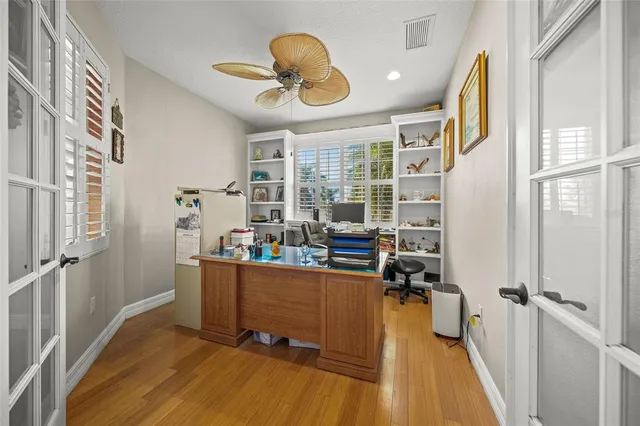a view of a dining room with furniture wooden floor and chandelier