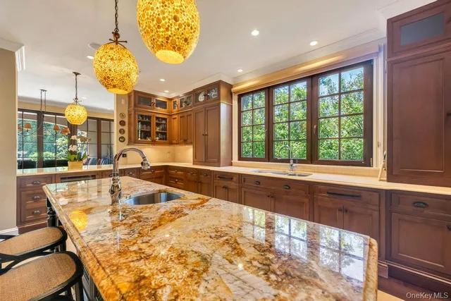 a bathroom with a large window and a sink