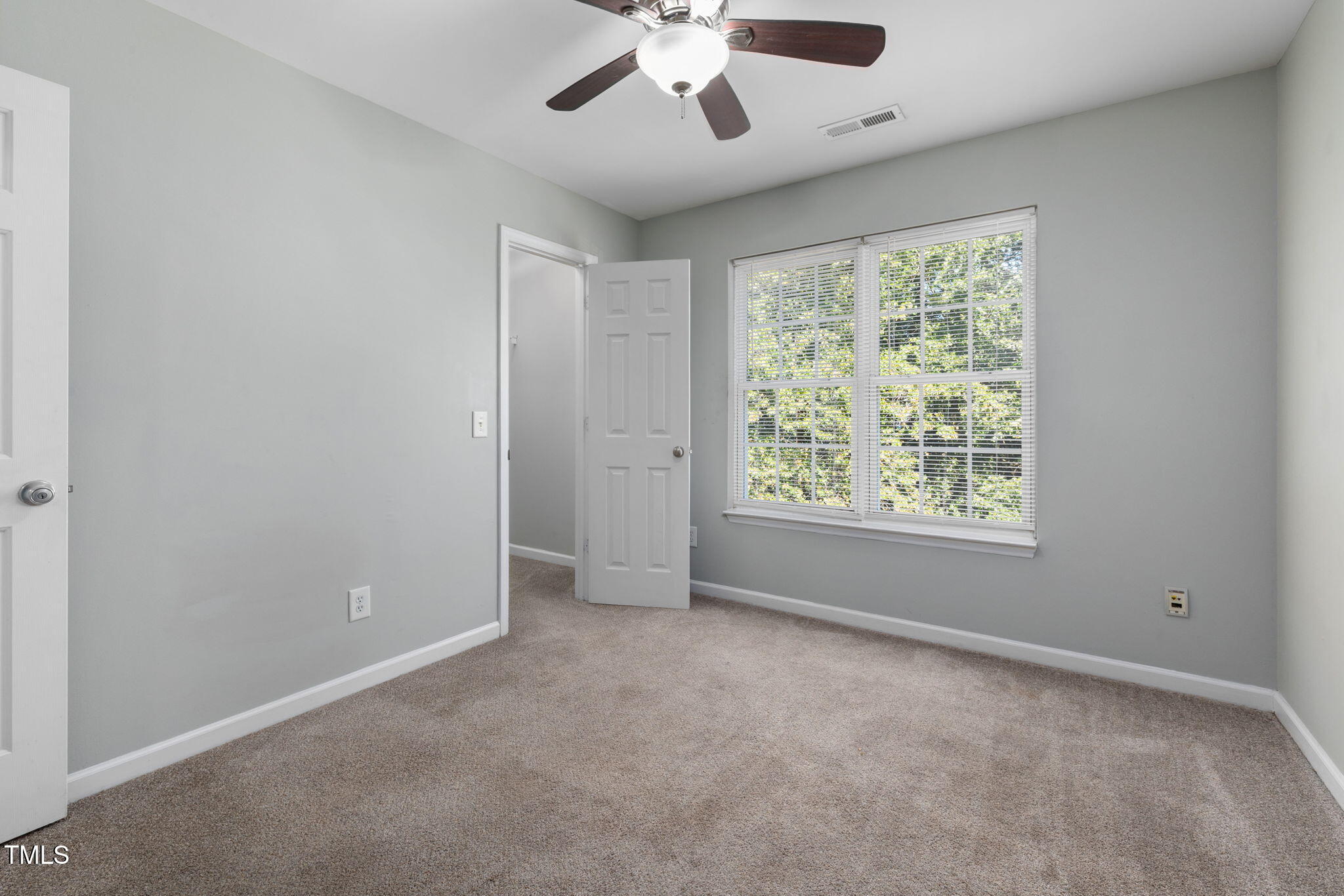 67 Red Lane Raleigh, NC 27606 - Photo 21 of 33 a view of an empty room with a window
