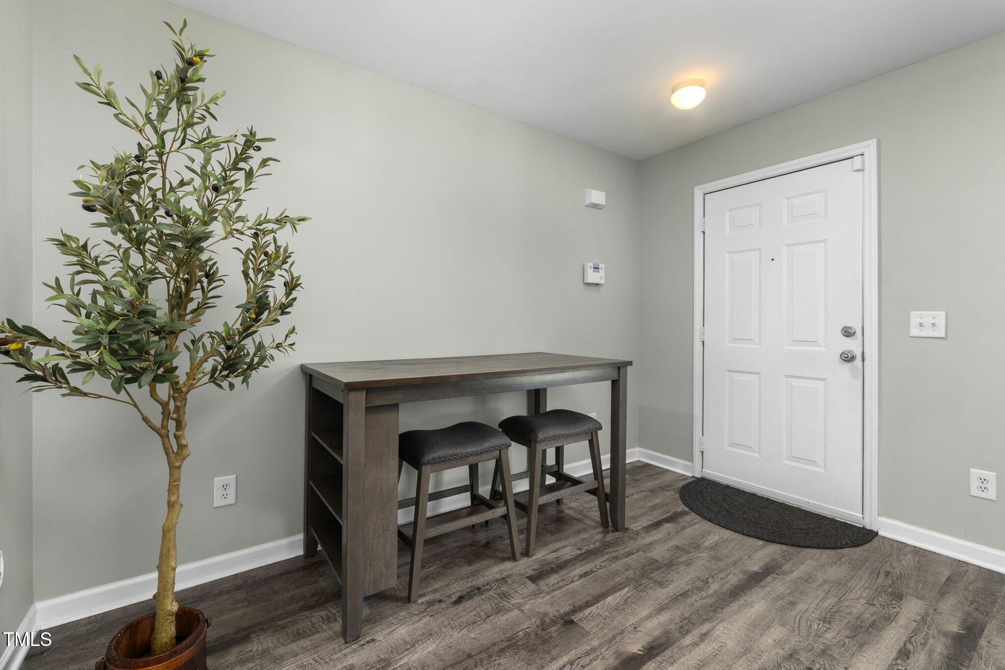 67 Red Lane Raleigh, NC 27606 - Photo 3 of 33 a workspace with furniture and a potted plant