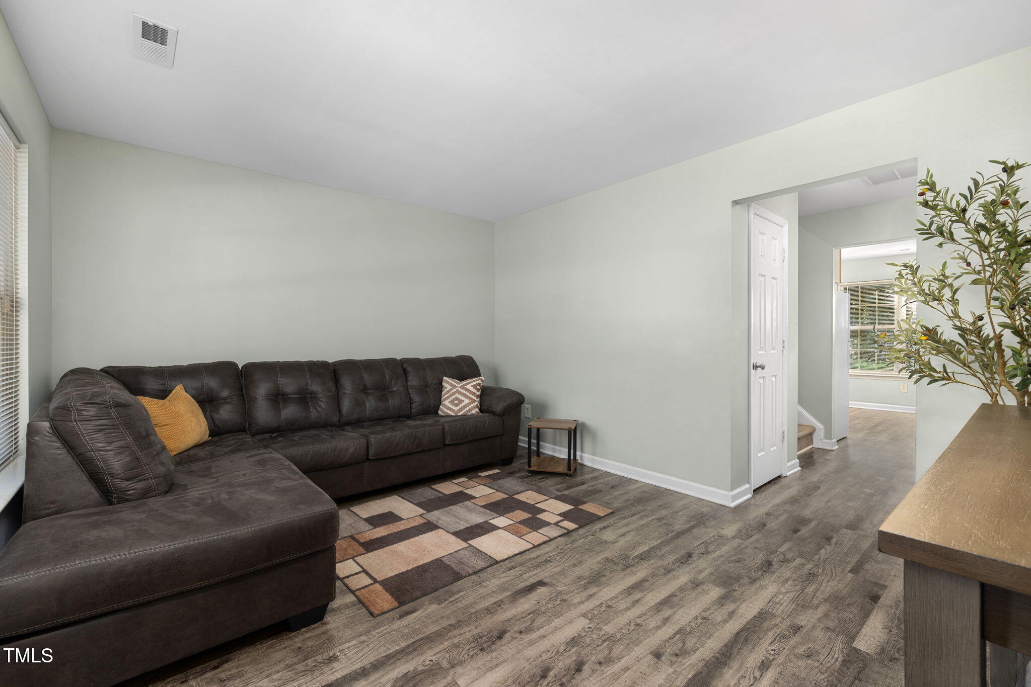 67 Red Lane Raleigh, NC 27606 - Photo 5 of 33 a living room with furniture and a wooden floor