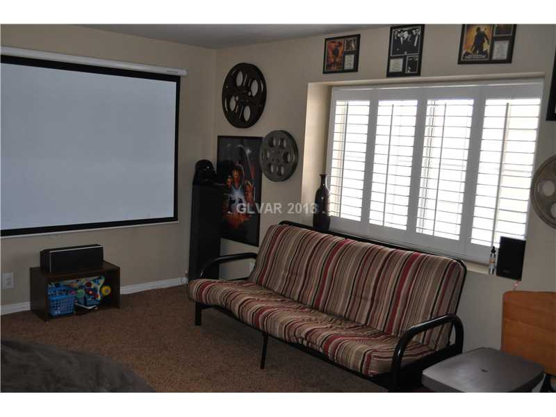 2037 Shadow Brook Way Henderson, NV 89074 - Photo 26 of 34 Bedroom. THIS IS THE LARGEST OF THE 3 OTHER BEDROOMS UPSTAIRS AND WAS USED AS A THEATRE ROOM. THIS ROOM IS ON FRONT SIDE OF HOME.