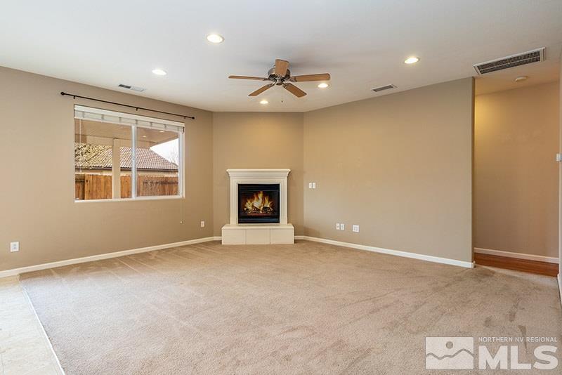 2010 Long Hollow Drive Reno, NV 89521 - Photo 6 of 24 an empty room with windows and fireplace