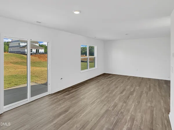 a kitchen with stainless steel appliances a microwave a stove a microwave and white cabinets